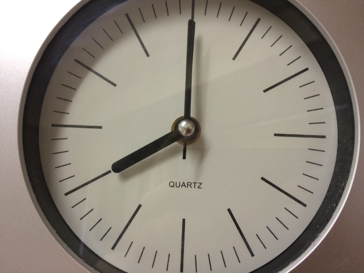 Plain clock face showing 8:00.